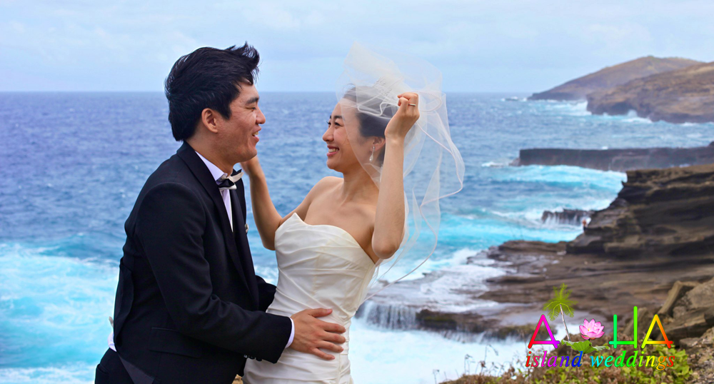 laughing together on the cliffs over looking the ocean